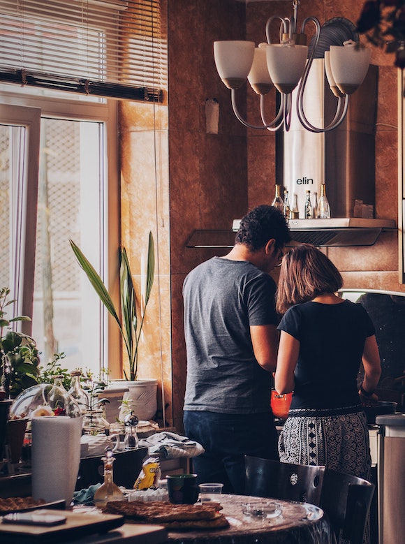 Two people talking in a new home